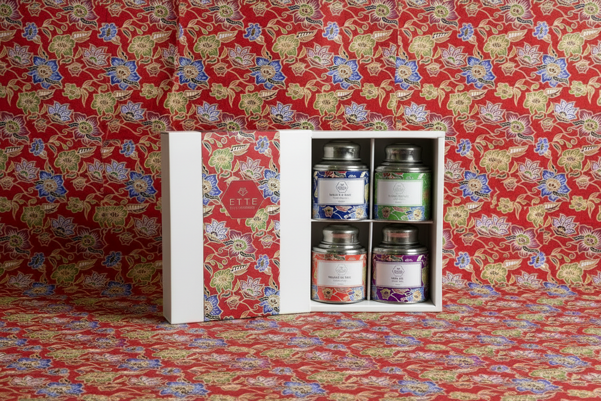 Set of jars with labels in a white box against a red floral patterned background