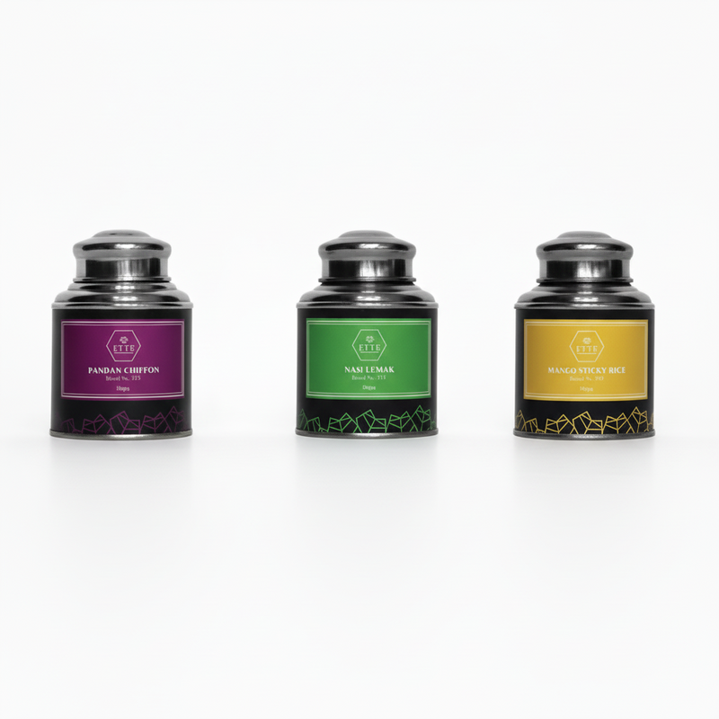 Three tea canisters with labels for Pandan Chiffon, Nasi Lemak, and Mango Sticky Rice.
