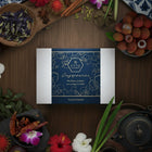 Product packaging with brand name on a wooden surface with decorative items