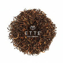 Dry black tea leaves with 'ETTE Tea Company' logo on a white background
