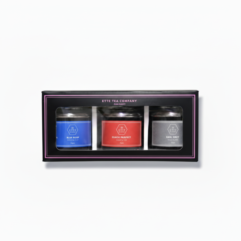 A box of Ette Tea Company's Mini Mix featuring three different colored jars of tea, each labeled with a movie quote.